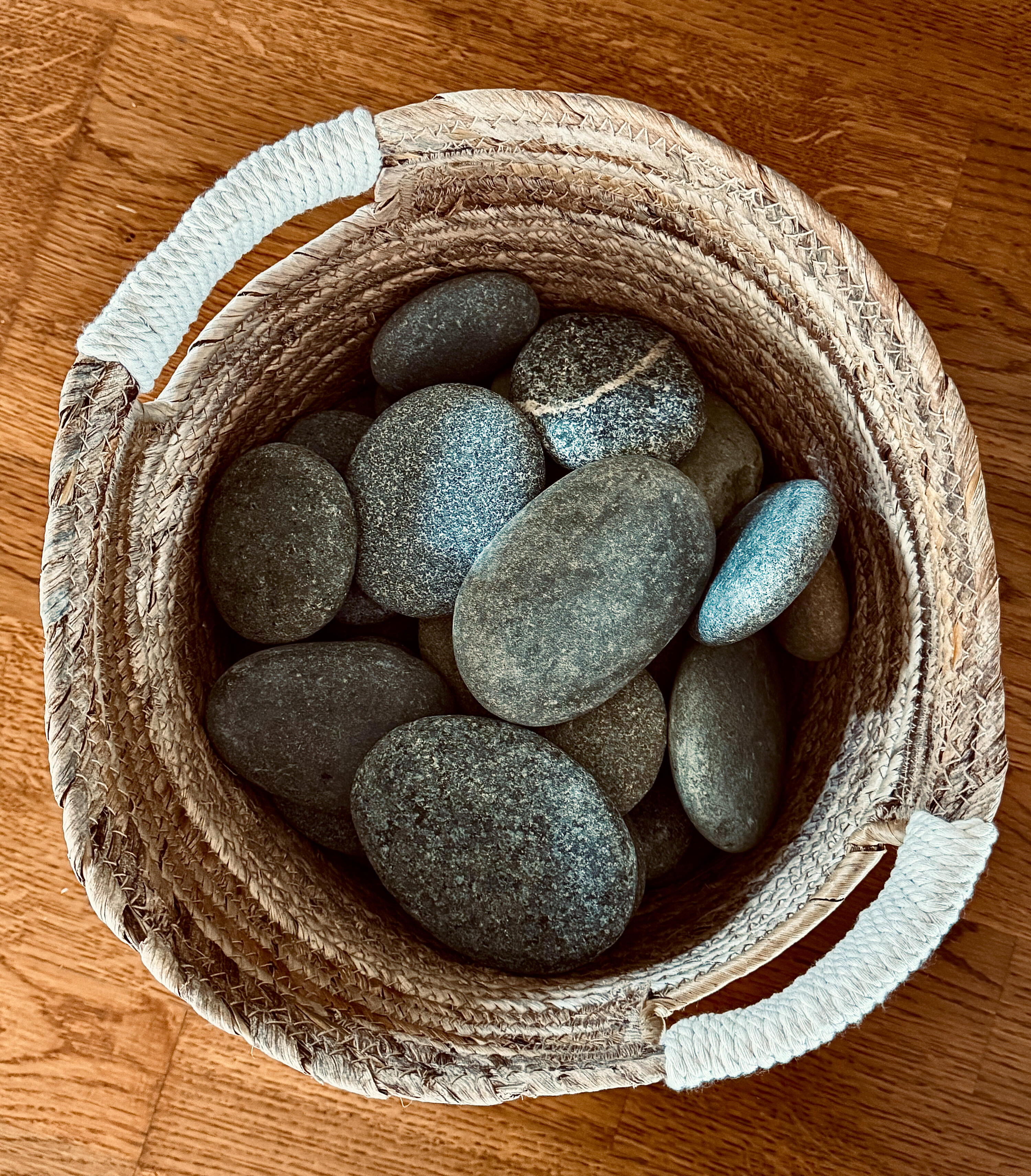 The Body Praying: Yoga for Christians River stones in a woven basket